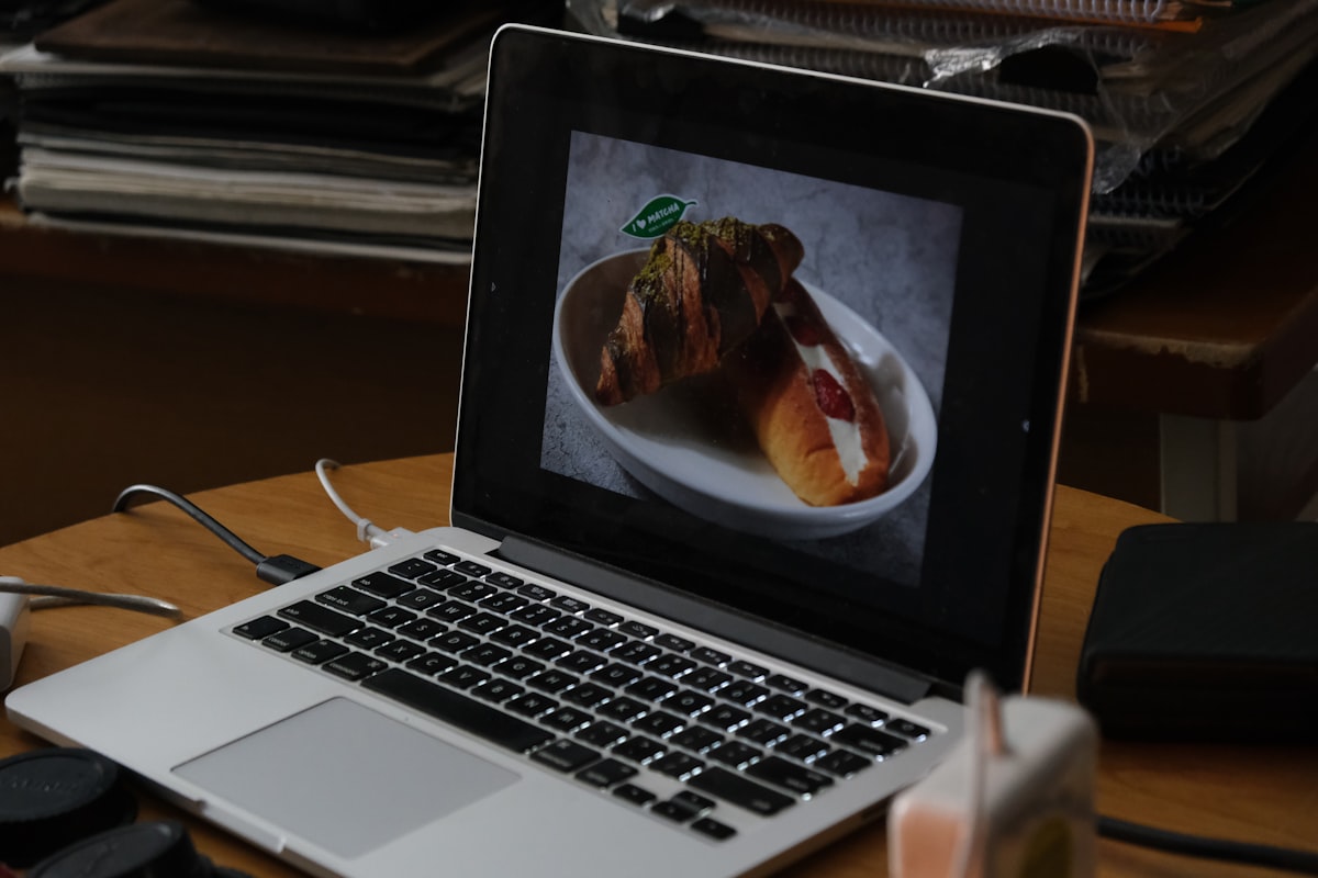 Chef instructor demonstrating pasta-making technique on live video call with families